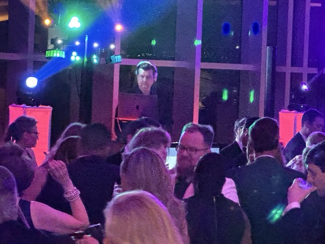 DJ selecting music for corporate event