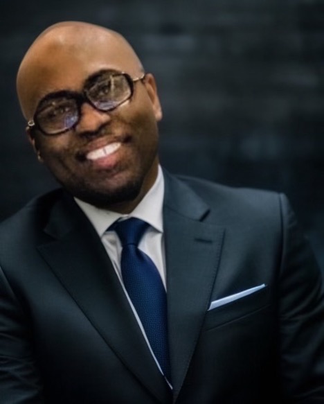 Professional DJ in business attire at corporate event