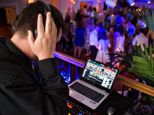 Professional DJ equipment setup with lighting at Jacksonville FL event