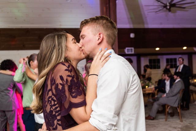 DJ entertaining multi-generational party crowd